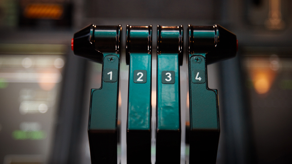 Close-up of a thrust control in an aircraft cockpit